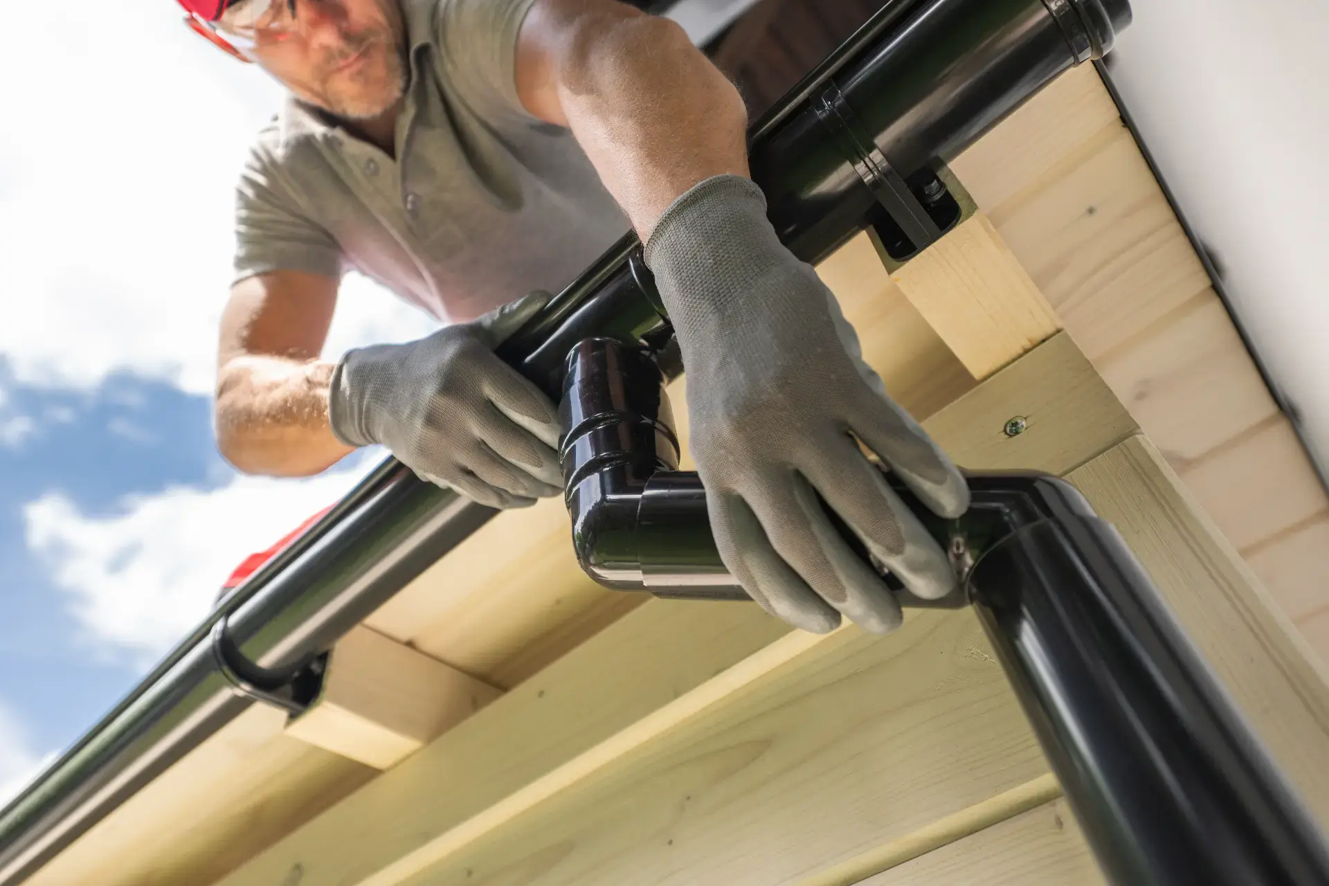 Gutter installation on a residential roofline in New Jersey